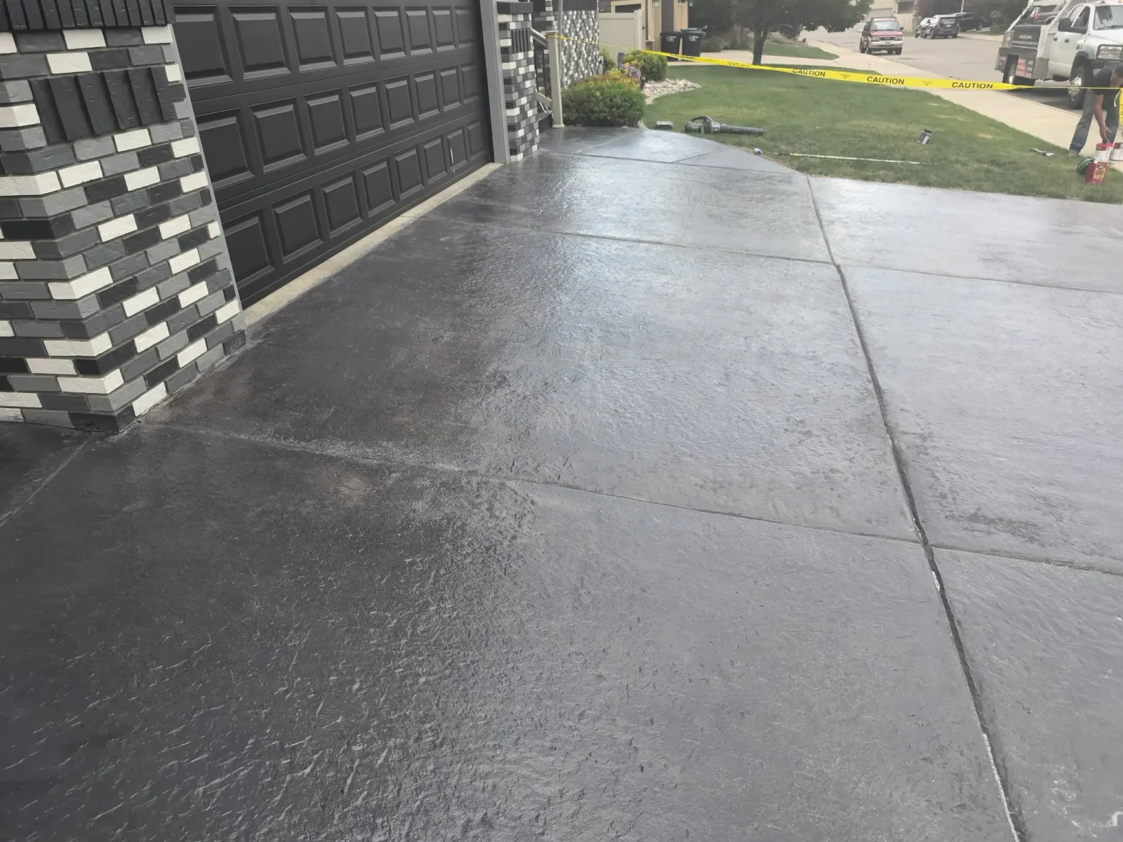New concrete driveway with control joints and smooth troweled finish